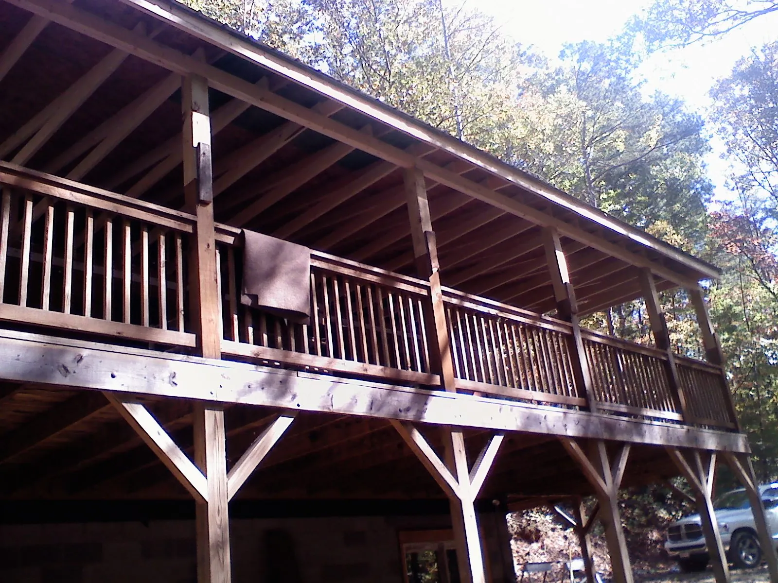 Timber framing under a new elevated porch and deck — Roof Leak Repair in Mission Hill by Roofing Brothers